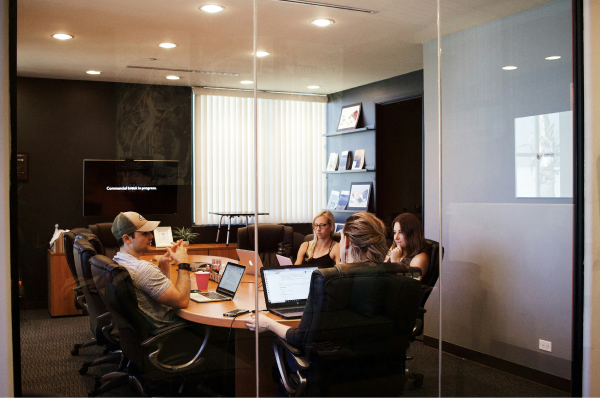 A group of people discussing work